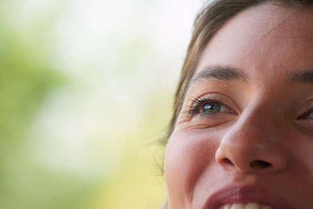 A portrait of a young smiling Hispanic female at daytime