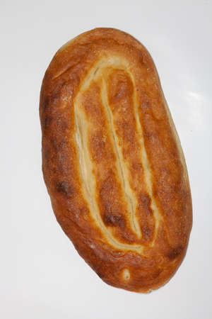 A close up shot of Armenian matnakash bread isolated on a white background