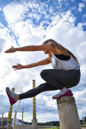 A sporty female training outdoorsの写真素材