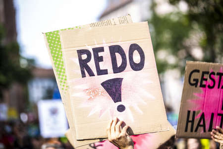 A closeup shot of the painted signs in a street protest