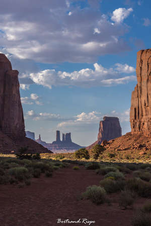 A beautiful scenery with a lot of bushes and rock formations under the cloudy skyの写真素材