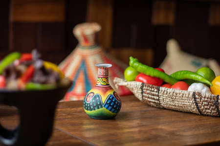 The African style glass pitcher with beautiful paintings on the tableの写真素材