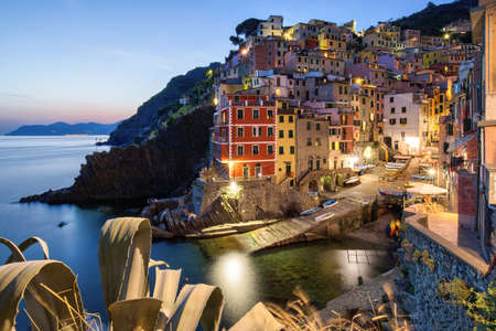 A beautiful high angle shot of the illuminated Cinque Terre sea Manarola Vernazza Rio Maggiore in Italyの写真素材