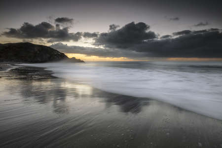 A gloomy susnet at the seashore in South Coast, Cornwall, UK