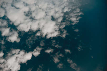 low angle shot of clouds in a dark blue sky