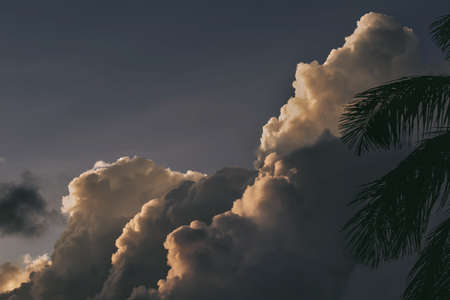 A beautiful shot of white cumulus clouds under the dark sky - great for a cool backgroundの写真素材