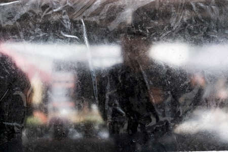 A horizontal shot of a black and white textile surface and a standing personの写真素材