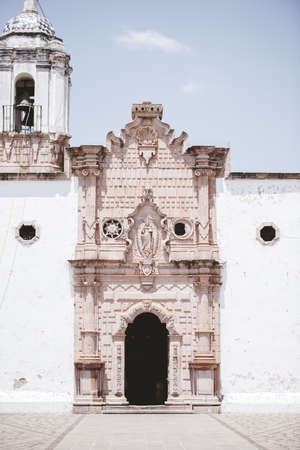 A vertical shot of an old catholic church in Mexico