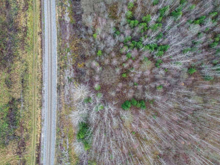 A high angle shot of a field with partially gone dry because of changes in weather