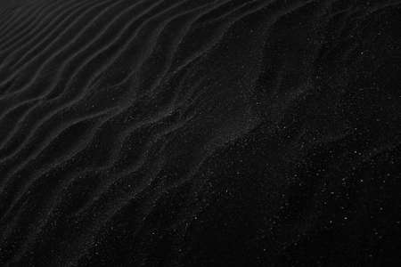 A high angle grey scale shot of the beautiful patterns on the sandsの写真素材