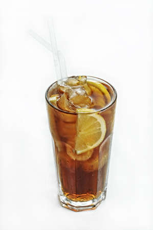 A vertical isolated shot of an iced coke with lemon in a glass - perfect for menu usageの写真素材