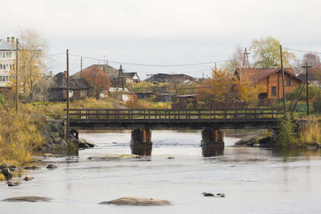 A beautiful shot of the city at the shore of the White Sea on cloudy weather in autumn