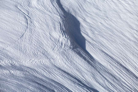 A high angle shot of snow textures with traces  in the Italian Alps