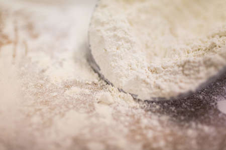 A closeup shot of a lot of flour at the process of making a dough - great for a backgroundの写真素材