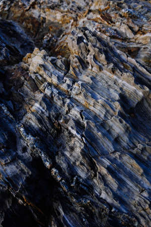 A vertical high angle shot of the breathtaking patterns on the rocky cliffs