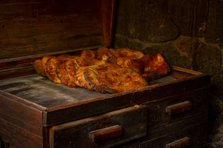 A closeup shot of delicious bread on an old wooden shelf - belongs to Armenian cuisine