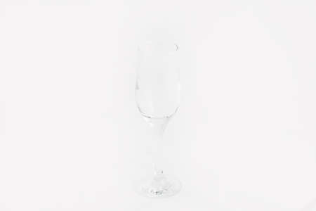 A closeup shot of a champagne stemware isolated on a white backgroundの写真素材
