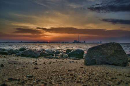 A beautiful sunset at the beach creating the perfect scenery for evening walks at the shore