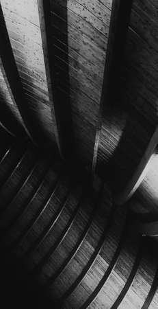 A vertical grey scale shot of the walls in a church captured from a low angleの写真素材