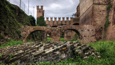 An ancient historic building complex in the middle of a greenfieldの写真素材