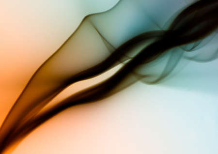 An abstract shot of the black smoke on colorful background - perfect for a cool vertical backgroundの写真素材
