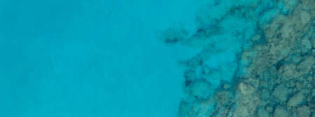 A high angle panoramic shot of a lot of rock formations in the ocean - great for a cool backgroundの写真素材