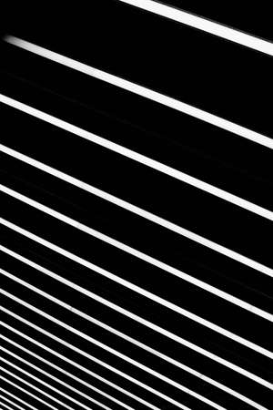 A vertical shot of a striped black and white surface