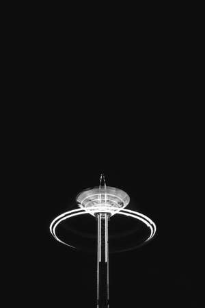 A spinning fairground ride in motion.の写真素材
