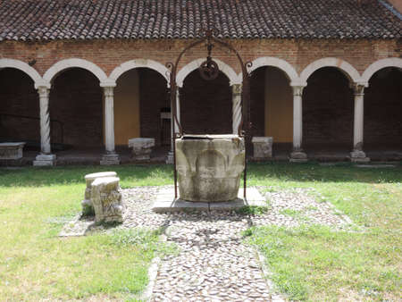 A garden of a historic ancient building in Ferrara, France