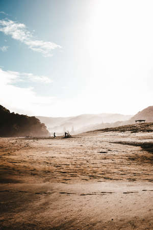 A vertical shot of the sandy fields under the cloudy skyの写真素材