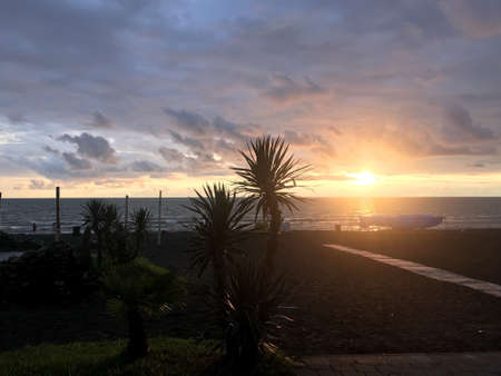 A breathtaking shot of the beautiful sunset in the beach of Shekhvetili village in Georgiaの写真素材