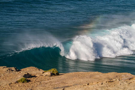 A beautiful shot of the waves of the shore of Fuerteventura Island in the Atlantic Oceanの写真素材