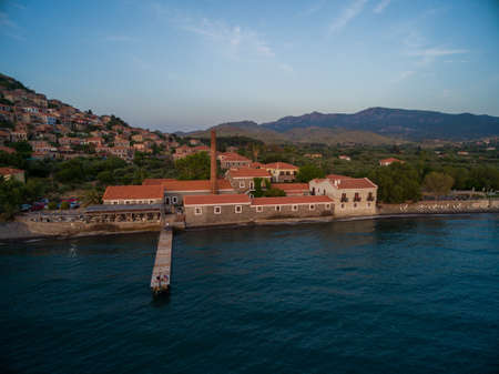 A building complex at the ocean under the clear sky in Lesbos, Greece