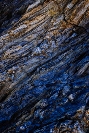 A vertical aerial shot of the patterns of the rocky cliffsの写真素材