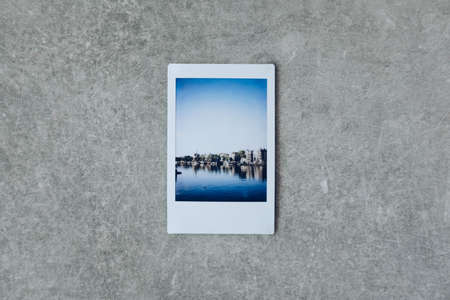 A  pictures of the ocean and the cliff on a grey surfaceの写真素材