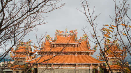 A low angle shot of Shinto shrine with interesting textures under the clear sky