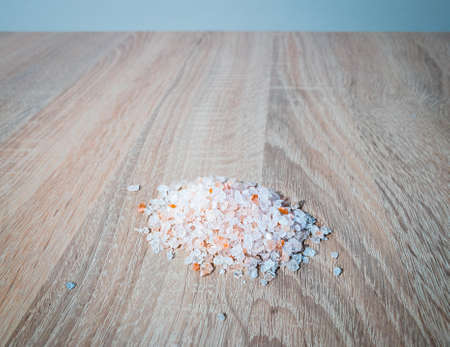 A high angle shot of bathroom salts on a wooden surface