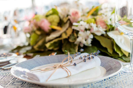 A beautiful table setting with folded napkins and floral decorations