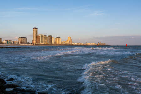 A beautiful scenery of the calm ocean waves moving towards the shore in Vlissingen, Zeeland, Netherlandsの写真素材