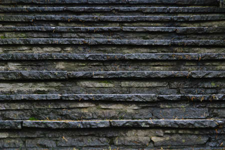 A low angle closeup shot of a stone staircase on a rainy day - perfect for a cool backgroundの写真素材
