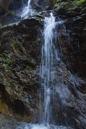 A vertical shot of a small waterfall on mountain Medvednica in Zagreb, Croatia