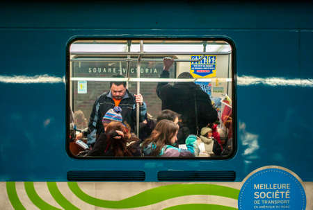 MONTREAL, CANADA - Jan 11, 2013: Montreal, Quebec / Canada - January 11 2013:  People inside the Subway, Two Men Standingのeditorial素材
