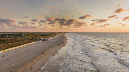a breathtaking view of the wavy ocean under the cloudy sky in Domburg, Netherlandsのeditorial素材