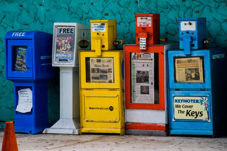 KEY LARGO, UNITED STATES - Aug 13, 2015: Colorful newspaper vending boxes matching the Florida vibe