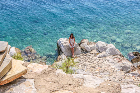 SKIATHOS, GREECE - Aug 23, 2019: Girl on Holiday 
Skiathos Greeceのeditorial素材