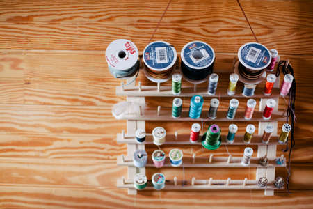 SEDALIA, VA, UNITED STATES - Apr 22, 2012: spools of thread on an artists wallのeditorial素材