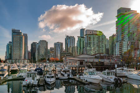 VANCOUVER, CANADA - Nov 13, 2019: A high angle shot of the boats parked near the Coal Harbour in Vancouverのeditorial素材