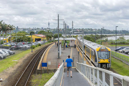 AUCKLAND, NEW ZEALAND - Dec 12, 2015: A group of people waiting in a train station in Auckland, New...