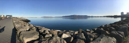 REYJKIAVIK, ICELAND - Sep 29, 2019: A panoramic shot of a lake in Reykjavik, Iceland on a sunny dayのeditorial素材