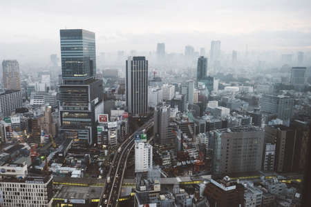 A high angle shot of an urban landscape with skyscrapers, beautiful buildings, and highways
